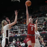 
              Utah guard Gianna Kneepkens (5) shoots next to Stanford forward Cameron Brink, left, during the first half of an NCAA college basketball game in Stanford, Calif., Friday, Jan. 20, 2023. (AP Photo/Godofredo A. Vásquez)
            