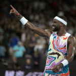 
              Frances Tiafoe of the U.S. celebrates after defeating Shang Juncheng of China in their second round match at the Australian Open tennis championship in Melbourne, Australia, Wednesday, Jan. 18, 2023. (AP Photo/Aaron Favila)
            