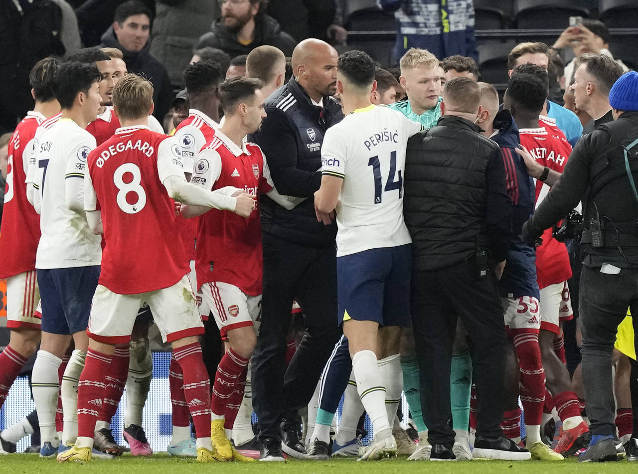 Players are in incident during the English Premier League soccer match between Tottenham Hotspur an...