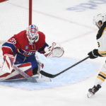 
              Boston Bruins' Pavel Zacha takes a shot on Montreal Canadiens goaltender Sam Montembeault during the second period of an NHL hockey game in Montreal, Tuesday, Jan. 24, 2023. (Graham Hughes/The Canadian Press via AP)
            