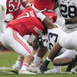 
              Utah quarterback Cameron Rising (7) is sacked by Penn State linebacker Curtis Jacobs (23) during the first half in the Rose Bowl NCAA college football game Monday, Jan. 2, 2023, in Pasadena, Calif. (AP Photo/Mark J. Terrill)
            