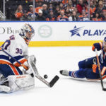 
              New York Islanders goalie Ilya Sorokin (30) makes the save against Edmonton Oilers' Leon Draisaitl (29) during second-period NHL hockey game action in Edmonton, Alberta, Thursday, Jan. 5, 2023. (Jason Franson/The Canadian Press via AP)
            