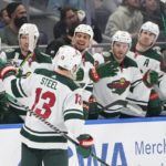 
              Minnesota Wild's Sam Steel (13) is congratulated for his goal during the third period against the New York Islanders in an NHL hockey game Thursday, Jan. 12, 2023, in Elmont, N.Y. The Wild won 3-1. (AP Photo/Frank Franklin II)
            