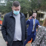 
              FILE - Texas men's basketball coach Chris Beard, second from left, walks out of the Travis County Jail in Austin, Texas, Monday, Dec. 12, 2022. Texas fired basketball coach Chris Beard on Thursday, Jan. 5, 2023, while he faces a felony domestic family violence charge stemming from a Dec. 12 incident involving his fiancée(Ricardo B. Brazziell/Austin American-Statesman via AP, File)
            