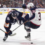 
              Columbus Blue Jackets' Boone Jenner (38) works against Edmonton Oilers' Connor McDavid (97) during the third period of an NHL hockey game Wednesday, Jan. 25, 2023, in Edmonton, Alberta. (Jason Franson/The Canadian Press via AP)
            
