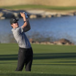 
              Davis Thompson hits from the fairway to the 18th hole during the American Express golf tournament on the Pete Dye Stadium Course at PGA West Saturday, Jan. 21, 2023, in La Quinta, Calif. (AP Photo/Mark J. Terrill)
            