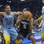 
              Memphis Grizzlies guard Desmond Bane (22) guards against Sacramento Kings guard De'Aaron Fox (5) during the first quarter of an NBA basketball game in Sacramento, Calif., Monday, Jan. 23, 2023. (AP Photo/Randall Benton)
            