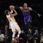 
              Atlanta Hawks' Trae Young (11) has his shot blocked by Los Angeles Lakers' Russell Westbrook (0) during the first half of an NBA basketball game Friday, Jan. 6, 2023, in Los Angeles. (AP Photo/Jae C. Hong)
            