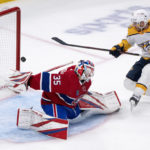 
              Nashville Predators' Colton Sissons, top right, hits the goalpost behind Montreal Canadiens goaltender Sam Montembeault (35) with the puck during second-period NHL hockey game action in Montreal, Thursday, Jan. 12, 2023. (Paul Chiasson/The Canadian Press via AP)
            