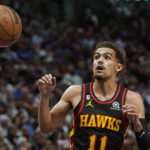 
              Atlanta Hawks guard Trae Young (11) takes a pass during the first quarter of an NBA basketball game against the Dallas Mavericks in Dallas, Wednesday, Jan. 18, 2023. (AP Photo/LM Otero)
            