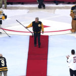 
              Hall of Fame hockey legend Bobby Orr raises his stick while introduced prior to the NHL Winter Classic hockey game between the Pittsburgh Penguins and Boston Bruins at Fenway Park, Monday, Jan. 2, 2023, in Boston. (AP Photo/Charles Krupa)
            