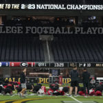 
              Georgia players work out during practice inside SoFi Stadium ahead of the national championship NCAA College Football Playoff game between Georgia and TCU, Saturday, Jan. 7, 2023, in Inglewood, Calif. The championship football game will be played Monday. (AP Photo/Marcio Jose Sanchez)
            