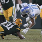 
              Detroit Lions wide receiver Kalif Raymond (11) is tackled by Green Bay Packers safety Adrian Amos (31) during the first half of an NFL football game Sunday, Jan. 8, 2023, in Green Bay, Wis. (AP Photo/Morry Gash)
            