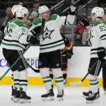 
              Dallas Stars defenseman Ryan Suter, second from right, celebrates after scoring against the Vegas Golden Knights during the third period of an NHL hockey game Monday, Jan. 16, 2023, in Las Vegas. (AP Photo/John Locher)
            