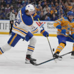 
              Buffalo Sabres' Tage Thompson (72) shoots as St. Louis Blues' Ivan Barbashev (49) defends during the first period of an NHL hockey game Tuesday, Jan. 24, 2023, in St. Louis. (AP Photo/Jeff Roberson)
            