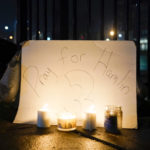 
              Fans place a sign and candles outside the University of Cincinnati Medical Center, early Tuesday, Jan. 3, 2023, in Cincinnati, where Buffalo Bills' Damar Hamlin was taken after collapsing on the field during an NFL football game against the Cincinnati Bengals on Monday night. (AP Photo/Jeff Dean)
            