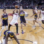 
              Miami Heat guard Kyle Lowry (7) shoots in the first half of an NBA basketball game against the New Orleans Pelicans in New Orleans, Wednesday, Jan. 18, 2023. (AP Photo/Gerald Herbert)
            