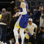 
              Golden State Warriors guard Donte DiVincenzo (0) celebrates after a 3-point basket against the Atlanta Hawks during the second half of an NBA basketball game in San Francisco, Monday, Jan. 2, 2023. (AP Photo/Jed Jacobsohn)
            