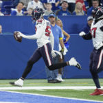 
              Houston Texans defensive end Jonathan Greenard (52) scores after an interception during the first half of an NFL football game between the Houston Texans and Indianapolis Colts, Sunday, Jan. 8, 2023, in Indianapolis. (AP Photo/Darron Cummings)
            