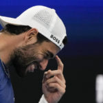 
              Italy's Matteo Berrettini reacts after losing a point to United States' Taylor Fritz during the final of the United Cup tennis event in Sydney, Australia, Sunday, Jan. 8, 2023. (AP Photo/Mark Baker)
            