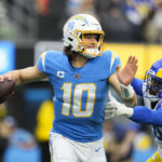 
              Los Angeles Chargers quarterback Justin Herbert (10) looks to throw a pass during the first half of an NFL football game against the Los Angeles Rams Sunday, Jan. 1, 2023, in Inglewood, Calif. (AP Photo/Marcio Jose Sanchez)
            