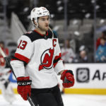 
              New Jersey Devils center Nico Hischier (13) skates during warmups before an NHL hockey game against the San Jose Sharks on Monday, Jan. 16, 2023, in San Jose, Calif. (AP Photo/Josie Lepe)
            
