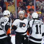 
              Philadelphia Flyers' Kevin Hayes, center, celebrates with James van Riemsdyk, left, and Travis Konecny after scoring a goal during the second period of an NHL hockey game against the Arizona Coyotes, Thursday, Jan. 5, 2023, in Philadelphia. (AP Photo/Matt Slocum)
            
