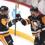 
              Pittsburgh Penguins' Jason Zucker (16) celebrates after his goal with Chad Ruhwedel during the first period of an NHL hockey game against the Anaheim Ducks in Pittsburgh, Monday, Jan. 16, 2023. (AP Photo/Gene J. Puskar)
            