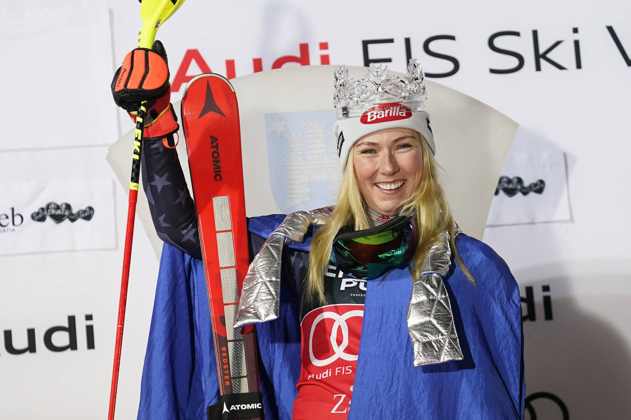 The winner United States' Mikaela Shiffrin celebrates after completing an alpine ski, women's World...