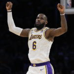 
              Los Angeles Lakers forward LeBron James (6) celebrates after scoring during the first half of an NBA basketball game against the Philadelphia 76ers in Los Angeles, Sunday, Jan. 15, 2023. (AP Photo/Ashley Landis)
            