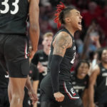 
              Cincinnati guard Jeremiah Davenport, right, reacts after making a 3-point basket during the first half of an NCAA college basketball game against Houston, Saturday, Jan. 28, 2023, in Houston. (AP Photo/Eric Christian Smith)
            