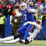 
              Buffalo Bills quarterback Josh Allen (17) is sacked by New England Patriots defensive tackle Daniel Ekuale (95) during the first half of an NFL football game, Sunday, Jan. 8, 2023, in Orchard Park. (AP Photo/Jeffrey T. Barnes)
            