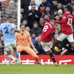 
              Manchester United's Bruno Fernandes scores his side's first goal during the English Premier League soccer match between Manchester United and Manchester City at Old Trafford in Manchester, England, Saturday, Jan. 14, 2023. (AP Photo/Dave Thompson)
            