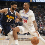 
              Los Angeles Clippers forward Norman Powell, right, drives as Denver Nuggets guard Jamal Murray defends during the second half of an NBA basketball game Thursday, Jan. 5, 2023, in Denver. (AP Photo/David Zalubowski)
            