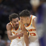 
              Atlanta Hawks guard Trae Young (11) and guard Bogdan Bogdanovic (13) talk during the first quarter of the team's NBA basketball game against the Sacramento Kings in Sacramento, Calif., Wednesday, Jan. 4, 2023. (AP Photo/José Luis Villegas)
            