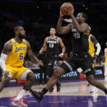 
              Sacramento Kings forward Harrison Barnes (40) charges the hoop against Los Angeles Lakers forward LeBron James (6) during the second half of an NBA basketball game in Los Angeles, Wednesday, Jan. 18, 2023. (AP Photo/Ashley Landis)
            