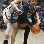 
              Georgetown's Kennedy Fauntleroy, right, is pressured by UConn's Nika Muhl in the first half of an NCAA college basketball game, Sunday, Jan. 15, 2023, in Hartford, Conn. (AP Photo/Jessica Hill)
            