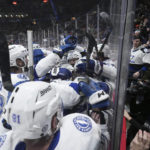 
              Tampa Bay Lightning's Steven Stamkos is mobbed by teammates after he scored against the Vancouver Canucks to record his 500th career goal, during the first period of an NHL hockey game Wednesday, Jan. 18, 2023, in Vancouver, British Columbia. (Darryl Dyck/The Canadian Press via AP)
            