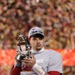 
              Kansas City Chiefs quarterback Patrick Mahomes holds the Lamar Hunt Trophy after the NFL AFC Championship playoff football game against the Cincinnati Bengals, Sunday, Jan. 29, 2023, in Kansas City, Mo. The Chiefs won 23-20. (AP Photo/Brynn Anderson)
            