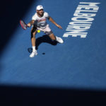 
              Tommy Paul of the U.S. plays a forehand return to compatriot Ben Shelton during their quarterfinal match at the Australian Open tennis championship in Melbourne, Australia, Wednesday, Jan. 25, 2023. (AP Photo/Dita Alangkara)
            