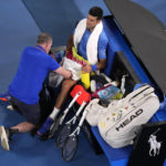 
              Novak Djokovic of Serbia receives treatment to a leg injury during his third round match against Grigor Dimitrov of Bulgaria at the Australian Open tennis championship in Melbourne, Australia, Saturday, Jan. 21, 2023. (AP Photo/Dita Alangkara)
            