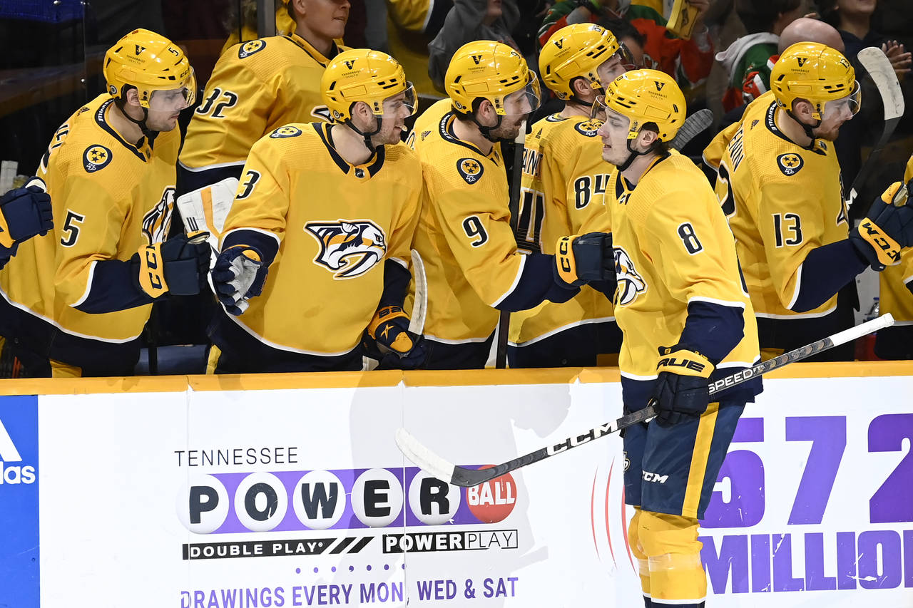 Nashville Predators center Cody Glass (8) is congratulated after his goal against the New Jersey De...