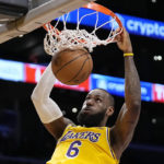 
              Los Angeles Lakers forward LeBron James dunks during the first half of an NBA basketball game against the San Antonio Spurs Wednesday, Jan. 25, 2023, in Los Angeles. (AP Photo/Mark J. Terrill)
            