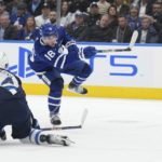 
              Toronto Maple Leafs right wing Mitchell Marner (16) shoots past Winnipeg Jets defenseman Josh Morrissey (44) to score a short-handed goalduring the second period of an NHL hockey game, Thursday, Jan. 19, 2023 in Toronto. (Nathan Denette/The Canadian Press via AP)
            