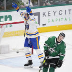 
              Buffalo Sabres defenseman Owen Power, left, celebrates after scoring in overtime as Dallas Stars left wing Jason Robertson (21) skates away from the net during an NHL hockey game, Monday, Jan. 23, 2023, in Dallas. (AP Photo/Tony Gutierrez)
            