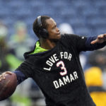 
              Seattle Seahawks quarterback Geno Smith warms up wearing a t-shirt with a message for Buffalo Bills safety Damar Hamlin before an NFL football game Los Angeles Rams Sunday, Jan. 8, 2023, in Seattle. (AP Photo/Abbie Parr)
            