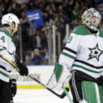 
              Dallas Stars goaltender Jake Oettinger and Jamie Benn (14) skate off the ice after losing to the New York Rangers in overtime of an NHL hockey game Thursday, Jan. 12, 2023, in New York. (AP Photo/Adam Hunger)
            