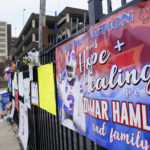 
              A sign sits along a fence outside UC Medical Center where Buffalo Bills safety Damar Hamiln remains hospitalized, Thursday, Jan. 5, 2023, in Cincinnati. Damar Hamlin has shown what physicians treating him are calling “remarkable improvement over the past 24 hours,” the team announced in a statement on Thursday, three days after the player went into cardiac arrest and had to be resuscitated on the field. (AP Photo/Joshua A. Bickel)
            