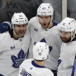 
              Toronto Maple Leafs' Pierre Engvall (47) celebrates his goal against the Boston Bruins with Mark Giordano (55), Zach Aston-Reese (12) and Calle Jarnkrok (19) during the second period of an NHL hockey game Saturday, Jan. 14 2023, in Boston. (AP Photo/Michael Dwyer)
            