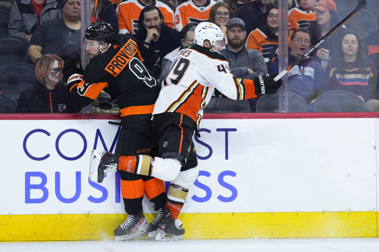 Philadelphia Flyers' Ivan Provorov, left, and Anaheim Ducks' Max Jones collide during the third per...